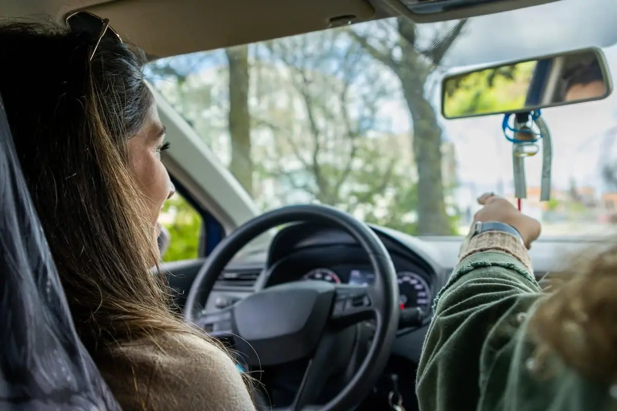 Two people driving in a car